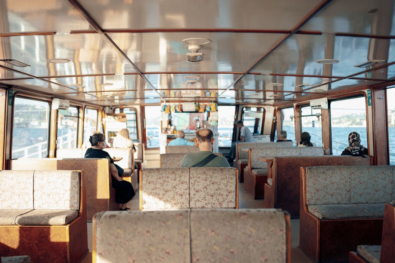 hero-img Passengers enjoying a comfortable ferry ride with scenic views. Perfect travel experience.